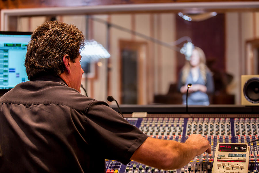 Male Recording Engineer and Artist in Studio Photograph by Grandriver