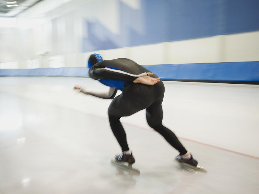 Male speed skater skating Photograph by Erik Isakson
