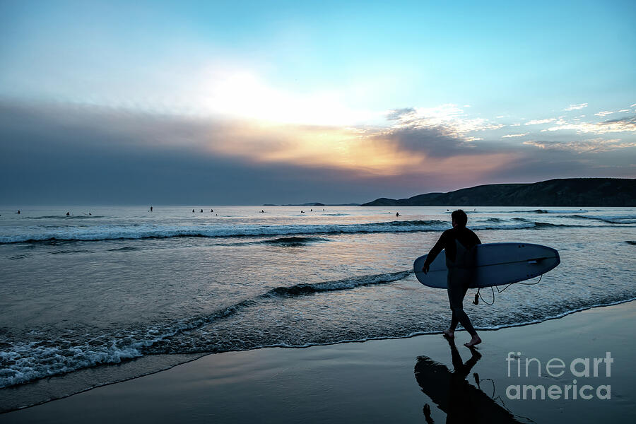 Male Surfer At Newgale Beach At The Atlantic Coast Of Pembrokeshire In Wales, United Kingdom Photograph by Andreas Berthold