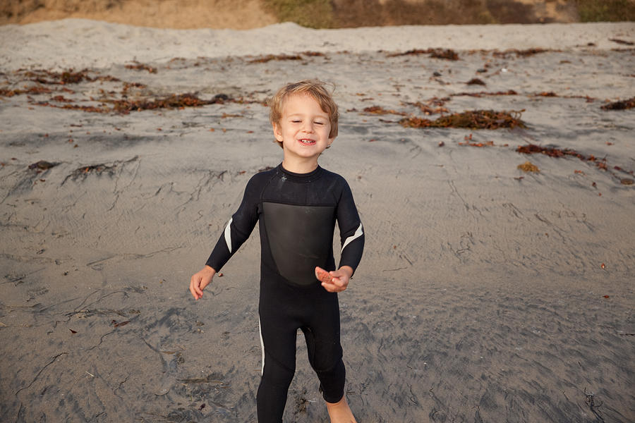 Male Toddler Playing On Southern California Beach In Wetsuit Photograph by Surfin_Rox