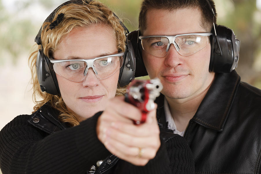 Man and Woman at the Shooting Range Photograph by RichLegg