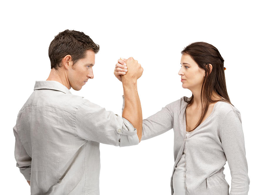 Man and woman doing arm wrestling showing their displeasure Photograph by Urilux