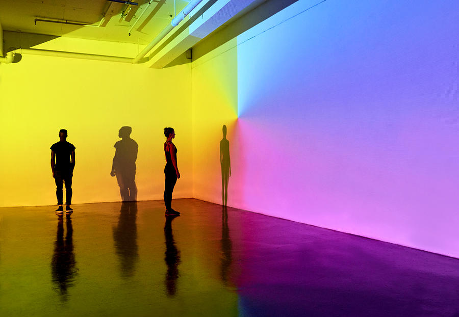 Man And Woman Standing In A Gallery Space With Colourful Walls Photograph by Mads Perch