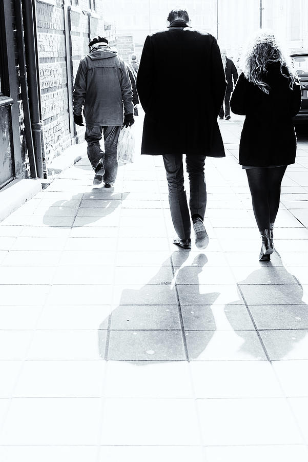 Man and Woman Walking Down Bright Street Photograph by John Williams