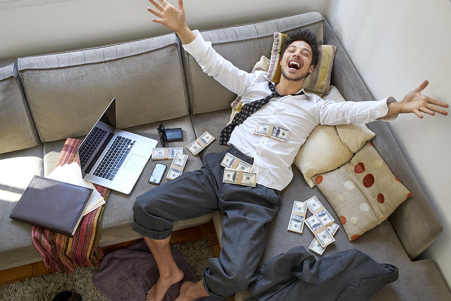 Man Bursting With Joy With Lots Of Money Photograph by Bambu Productions