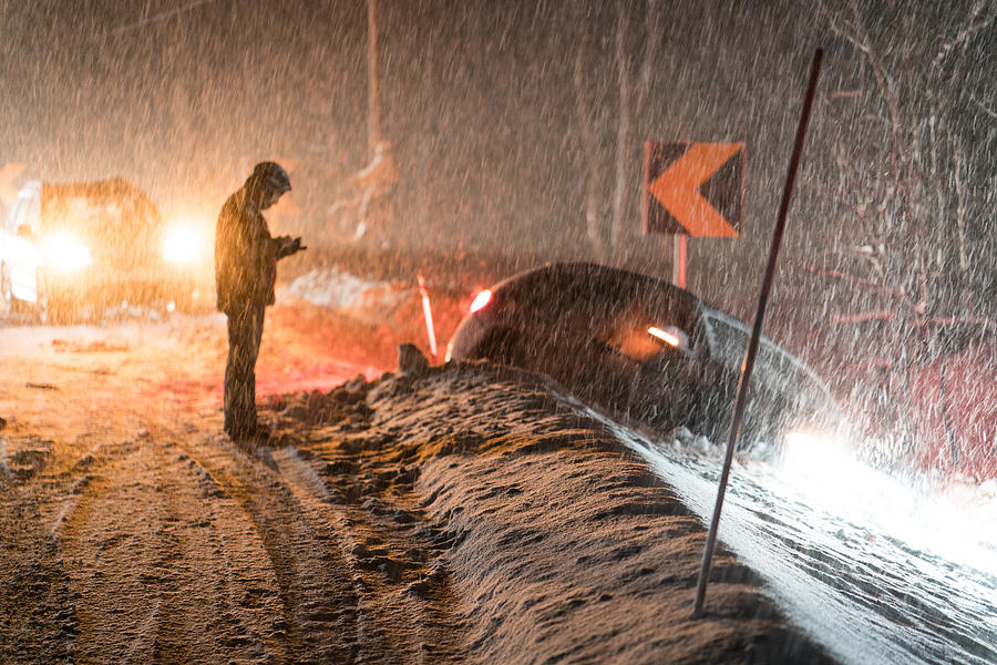 Man calling for help for car accident in snow Photograph by Jasmin Merdan