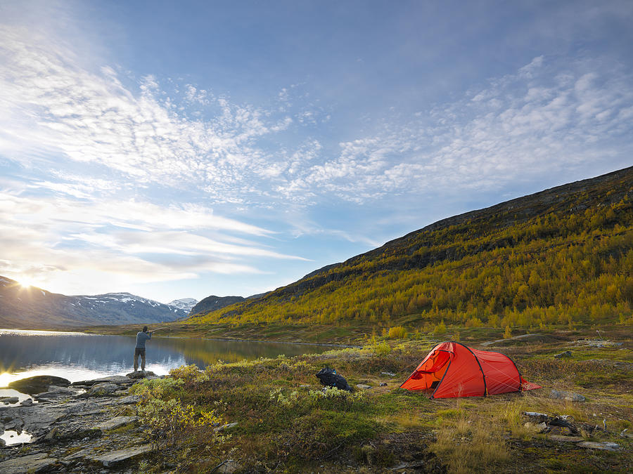 Man camping Photograph by Johner Images