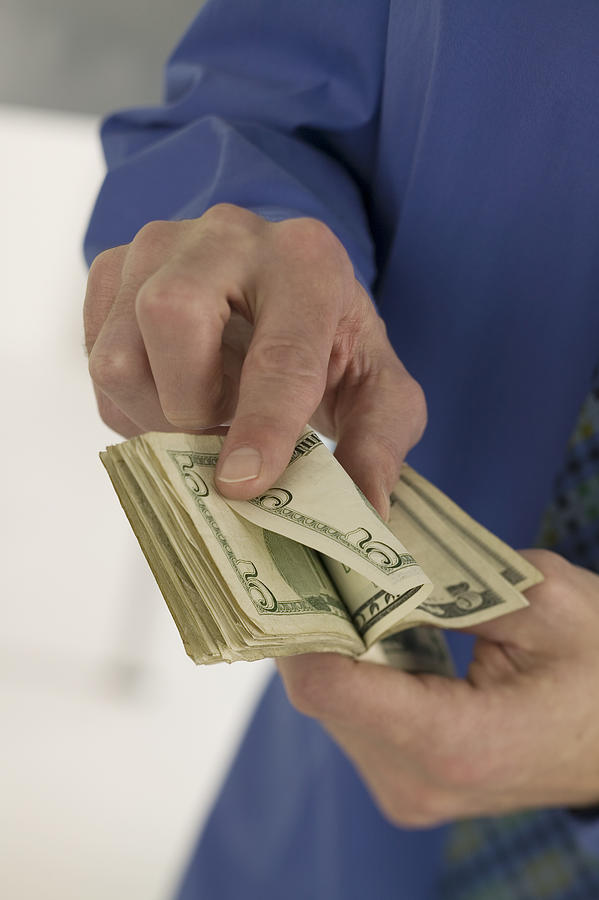 Man counting money Photograph by Comstock Images