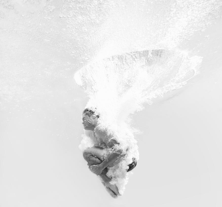 Man Dive Bombing Into Water Photograph by Tara Moore