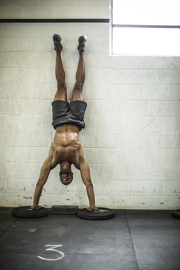 Man Doing Handstand Pushups Photograph by MoMo Productions