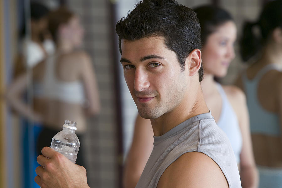 Man drinking bottled water Photograph by Comstock Images