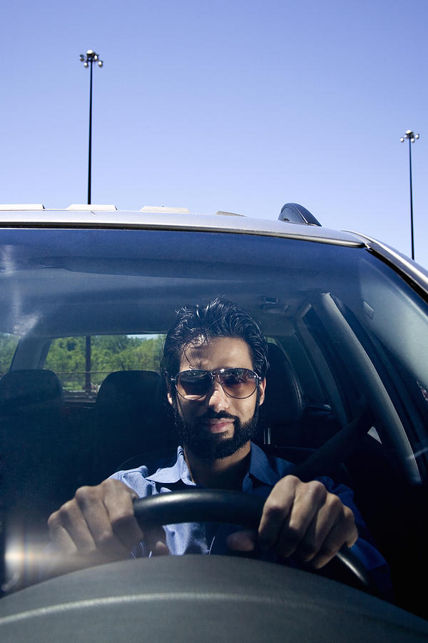 Man driving car Photograph by Rana Faure