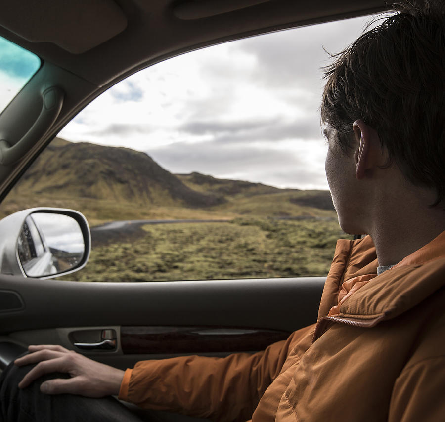 Man driving in remote landscape Photograph by Kyle Monk