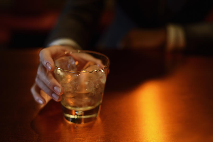 Man enjoying a drink at the bar Photograph by Yagi Studio