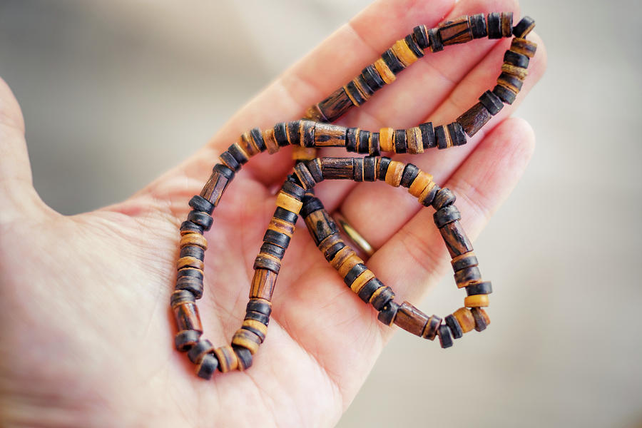 Man Hand Hold Necklace Traditional Wood Background Photograph by Luca ...