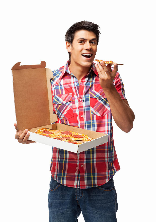 Man Having Slice Of Pepperoni Pizza - Isolated Photograph by Neustockimages