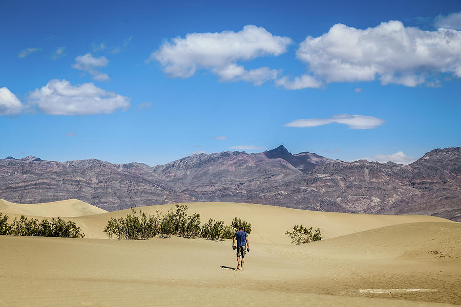 Man hiking in Death Valley NP Photograph by Alberto Zanoni
