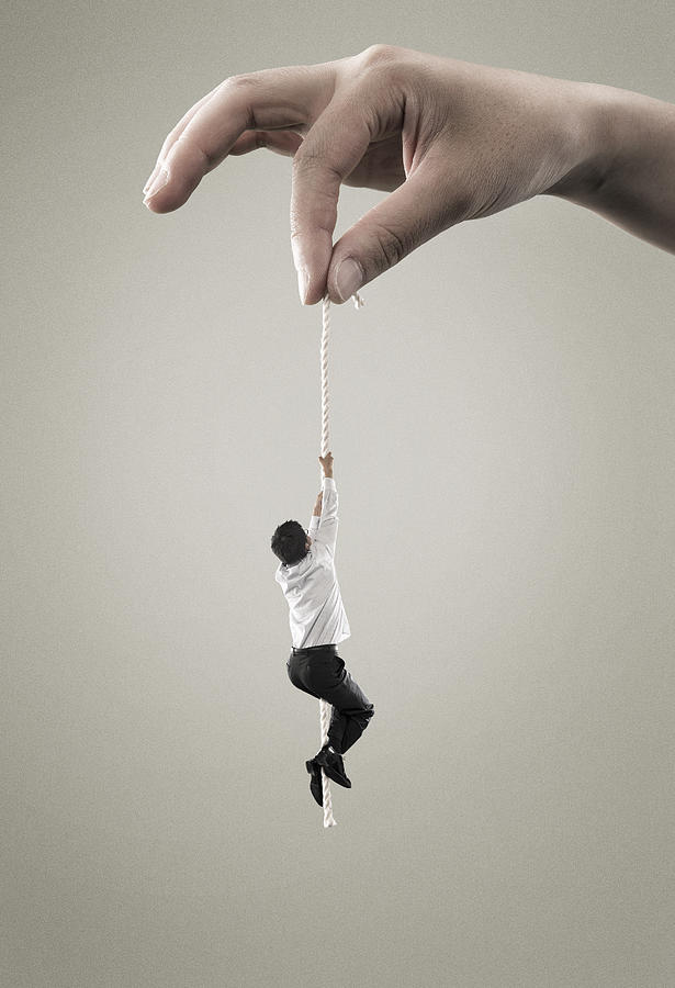 Man hold on to rope Photograph by Yagi Studio