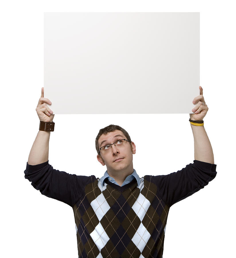Man holding a blank sign overhead on white background. Photograph by Phillipspears