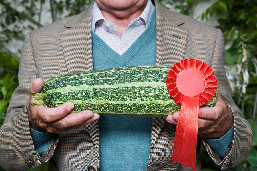 Man holding a winning marrow Photograph by Image Source
