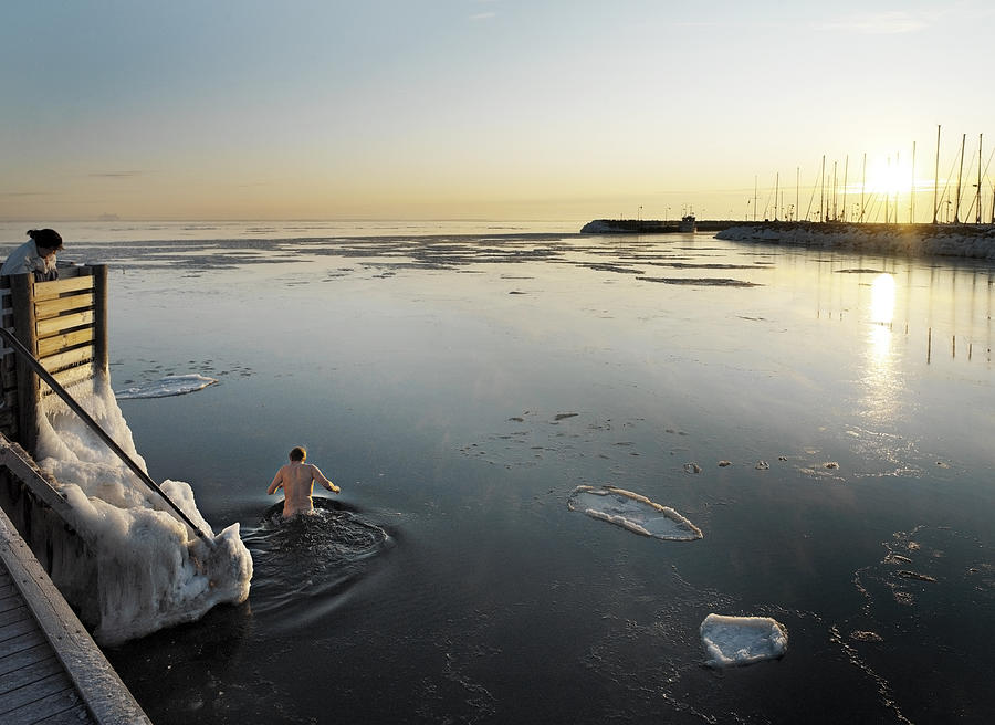 Man in icy sea. Photograph by David Trood