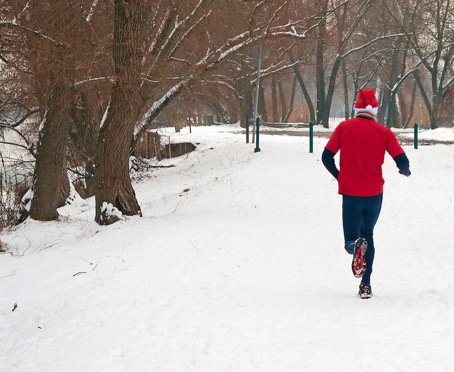 Man in red running in the snow Photograph by To_csa