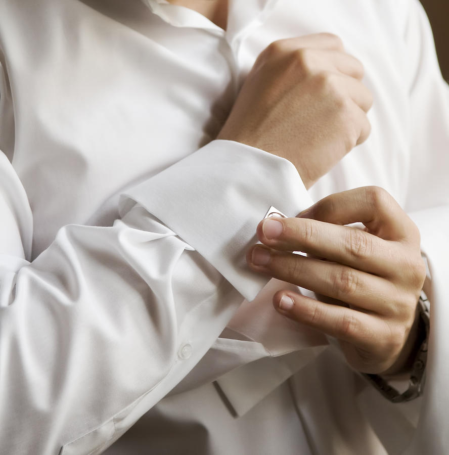 Man in white shirt wearing cufflinks Photograph by Digihelion