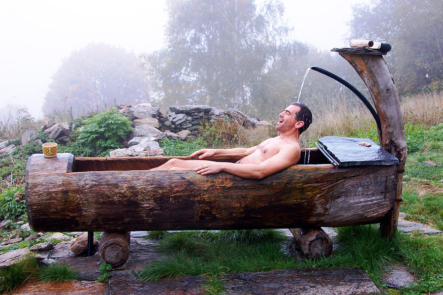 Man in wooden bathtub Photograph by Sylwia Duda