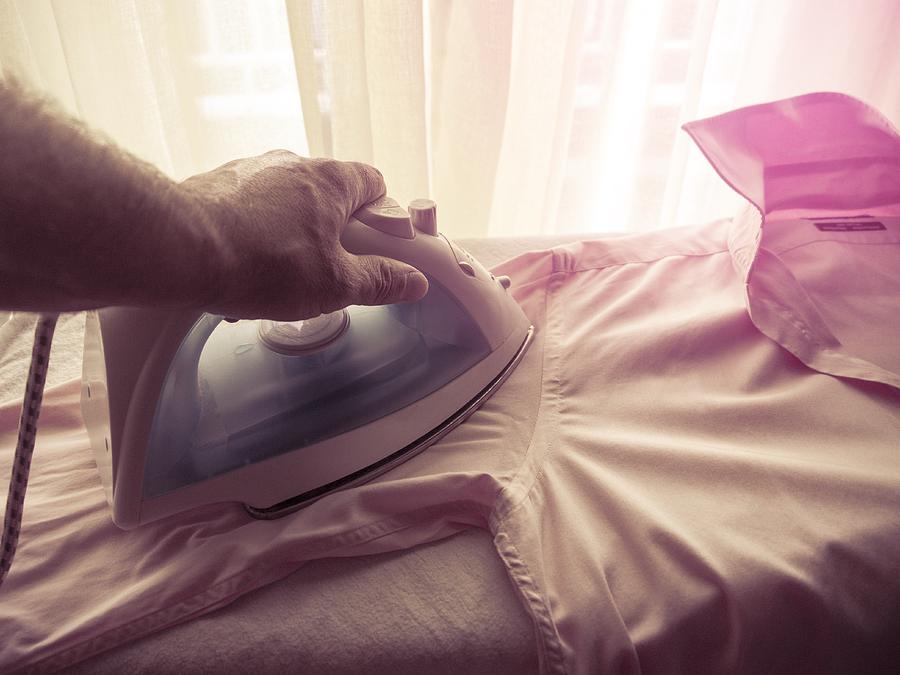 Man ironing his shirt Photograph by Blade_kostas