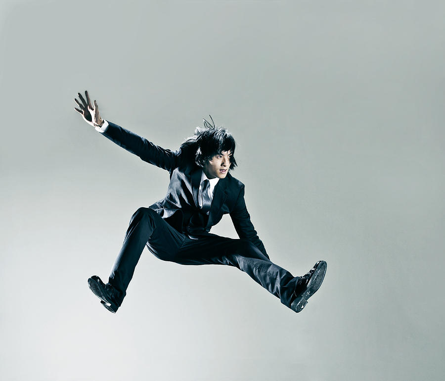 Man jumping Photograph by Ting Hoo