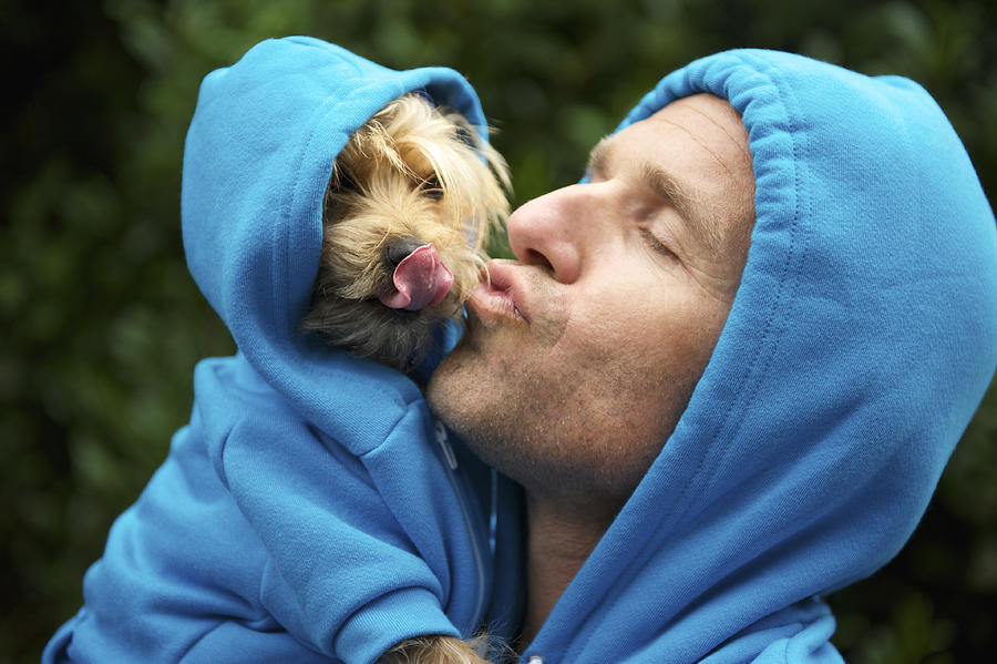 Man Kissing Best Friend Dog Matching Blue Hoodies at Park Photograph by PeskyMonkey
