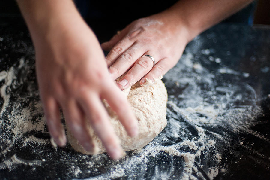 Man kneading bread dough Photograph by Elizabeth Livermore