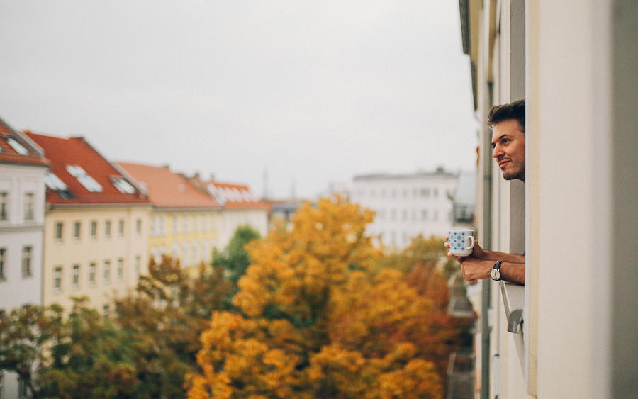 Man looking through the apartment window in Berlin Prenzlauer Berg Photograph by Lechatnoir