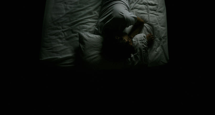 Man Lying On Bed In The Dark Photograph by © 2011 Luke Sharratt