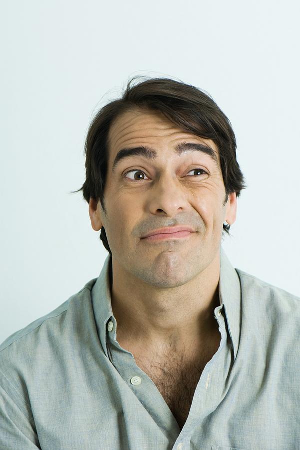 Man making face, portrait Photograph by PhotoAlto/Michele Constantini