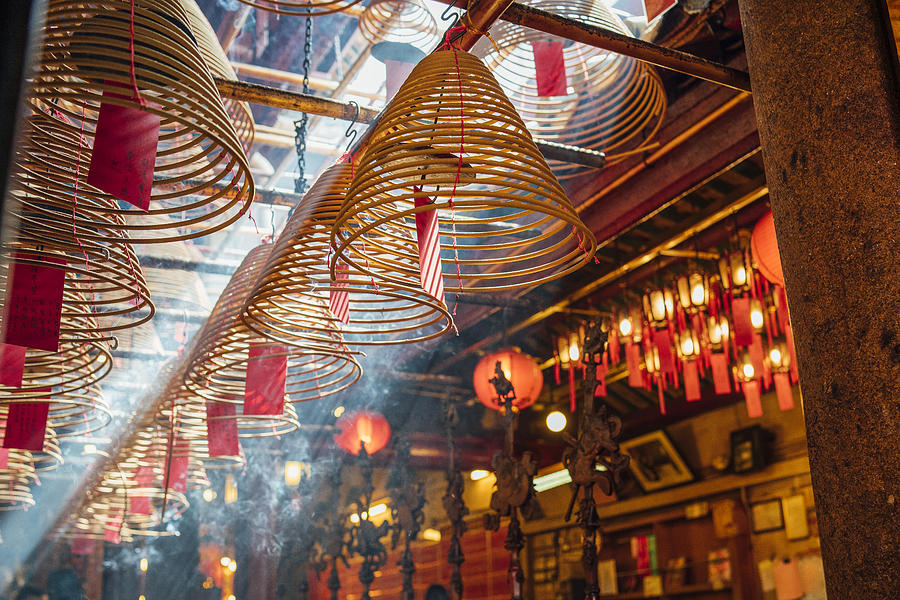 Man Mo Temple in Hong Kong with sun beams and incense Photograph by FilippoBacci