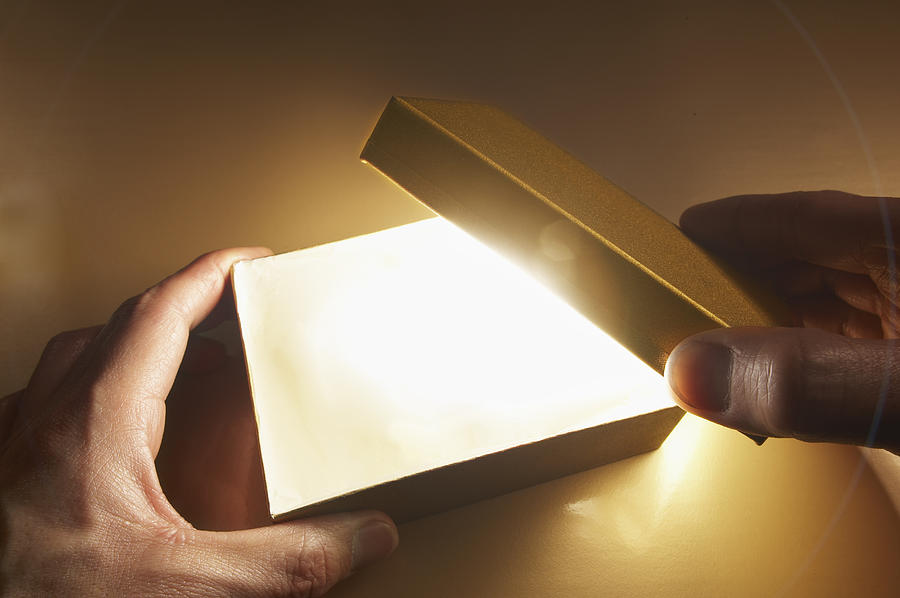 Man Opening A Box With Light Coming Out. Photograph by D-base