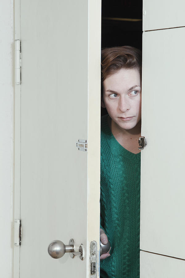 Man peeking through doorway Photograph by Elke Meitzel