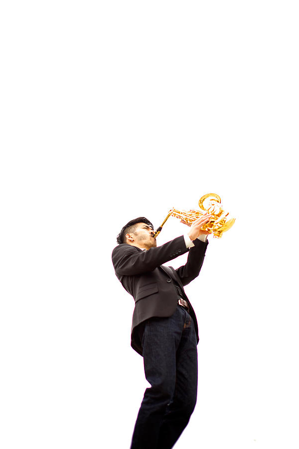 Man playing the saxophone Photograph by Tadamasa Taniguchi