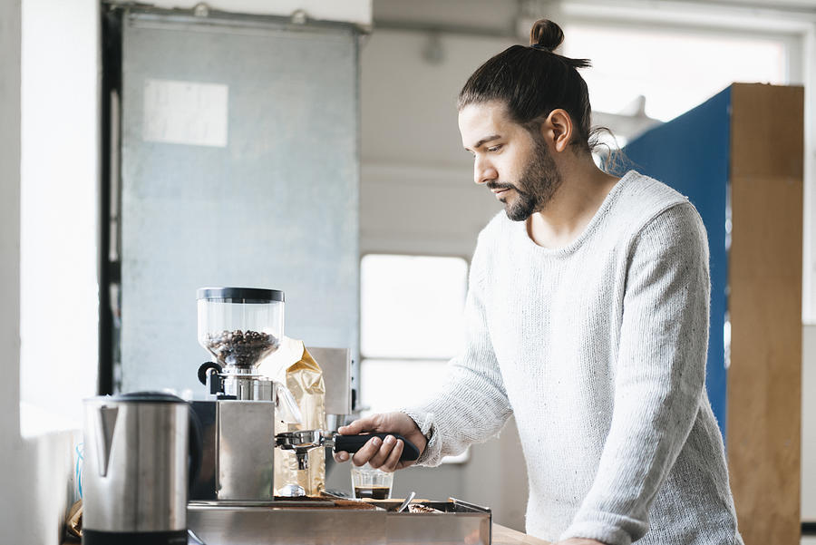 Man preparing espresso with espresso machine Photograph by Westend61