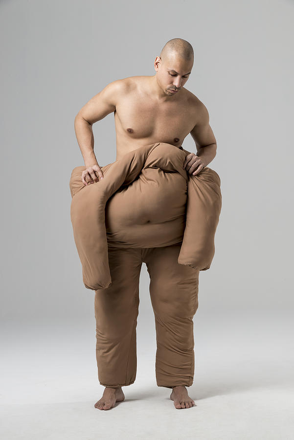 Man pushing off fat suit Photograph by Nisian Hughes