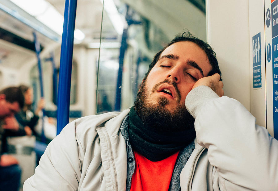 Man sleeping on the subway Photograph by Giulia Fiori Photography