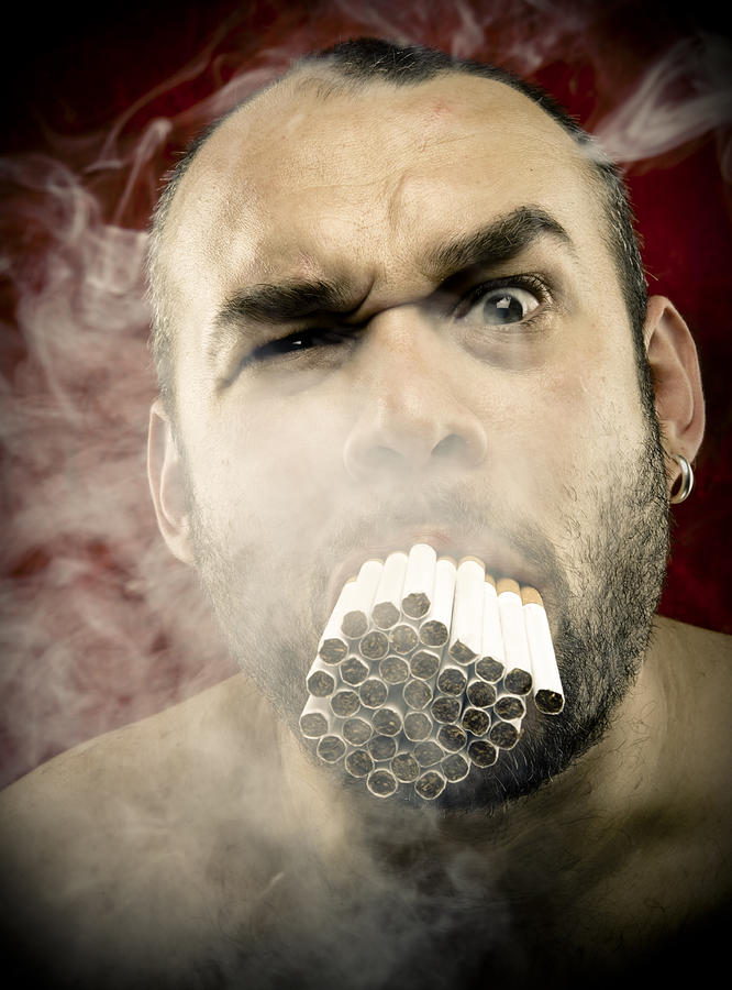 Man Smoking Many Cigarettes in his Mouth Photograph by 1001nights