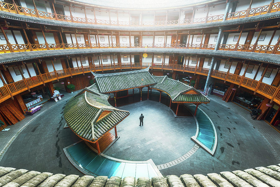 Man standing in Hakka traditional round house Photograph by Philippe Lejeanvre