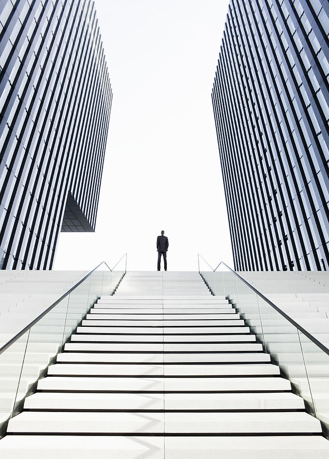 Man standing on top of stairs Photograph by Jorg Greuel