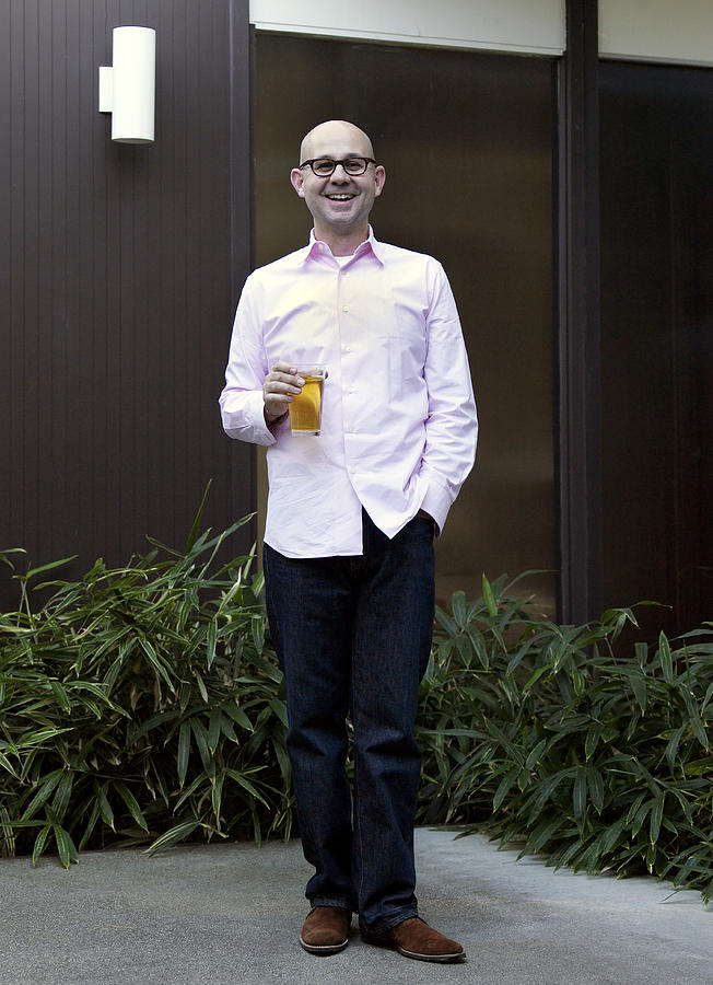 Man standing with drink Photograph by Jim Bastardo