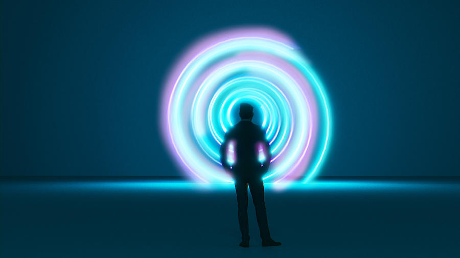 Man stands in front of a vortex or time machine with a spiral pattern Photograph by Mikkelwilliam