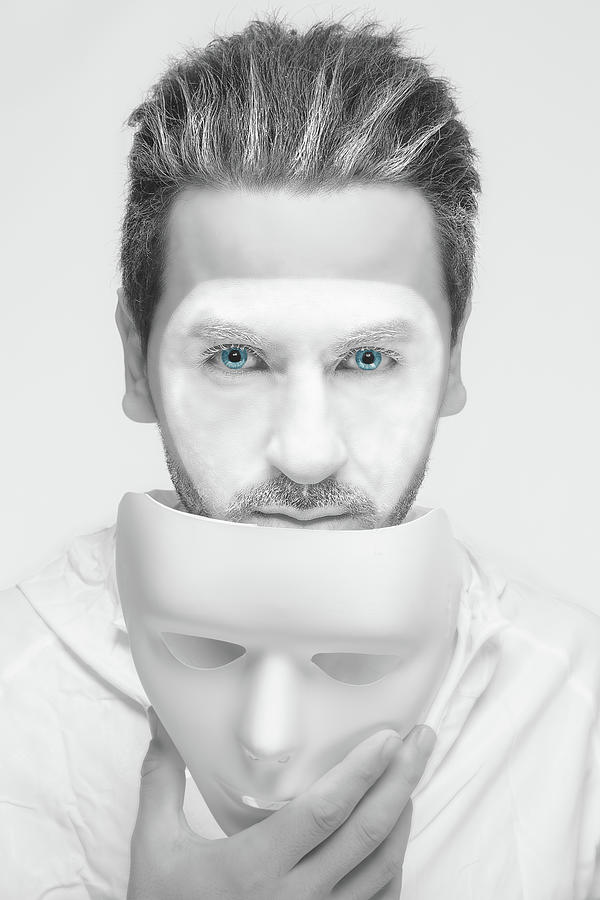 Man Taking Mask Off Showing The Real Emotion Of Anger That Hidde