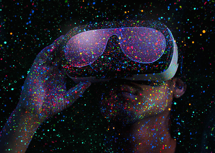 Man using virtual reality headset with Black Light Photograph by Yagi Studio