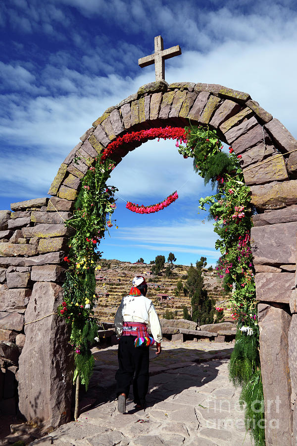 Rural Scene Photograph - Man walking through stone archway Taquile Island Peru by James Brunker